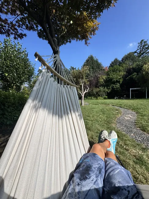 A quiet moment in a hammock beneath the trees.