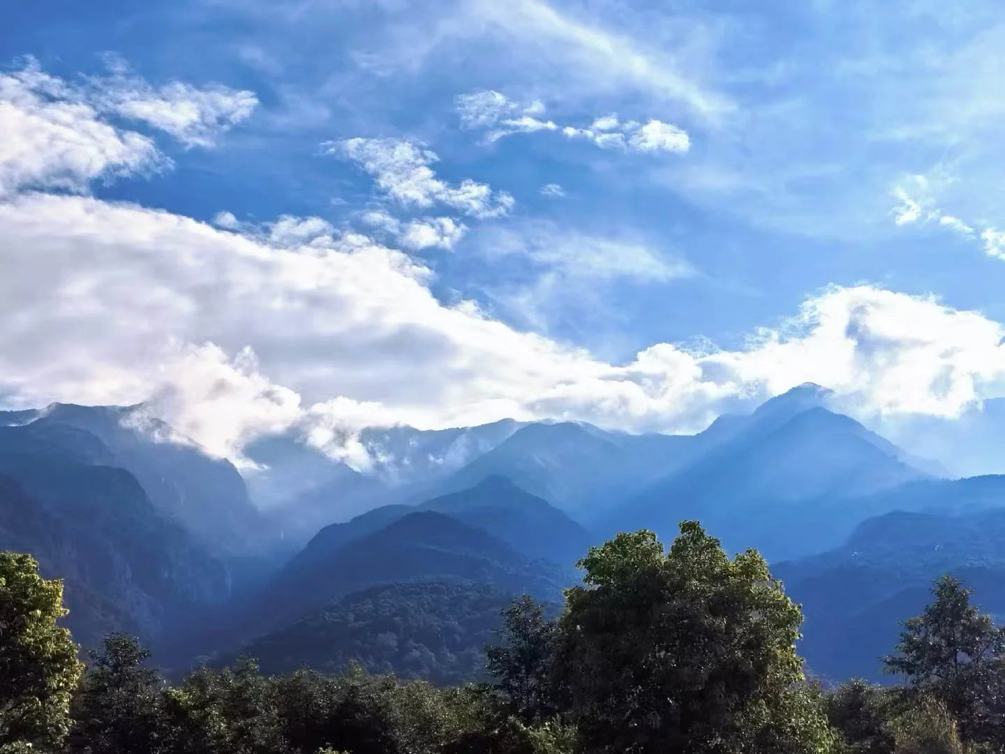 Blue mountain layers beneath the sky in Cangshan