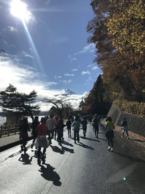 The skies clear along the lakeside road.