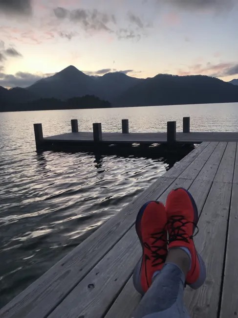 A lakeside pause in my running shoes.