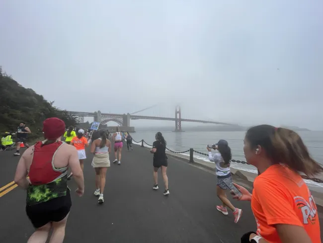 Running toward the Golden Gate Bridge in the fog.